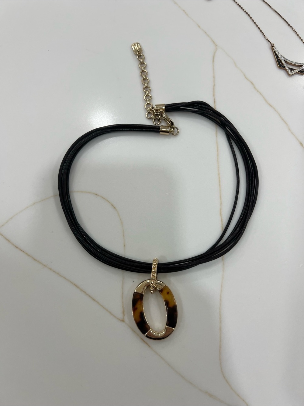 Black Multi-Strand Necklace with Oval Pendant and Gold Accents